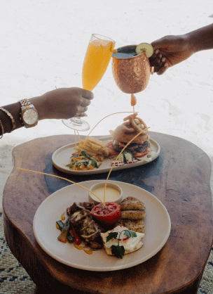 Staff serving guests at Palm Beach Watamu